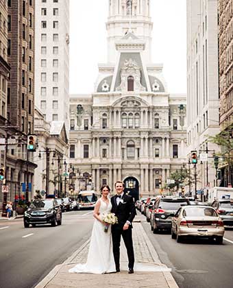 Bride and Groom in the street in front of Philadelphia City Hall